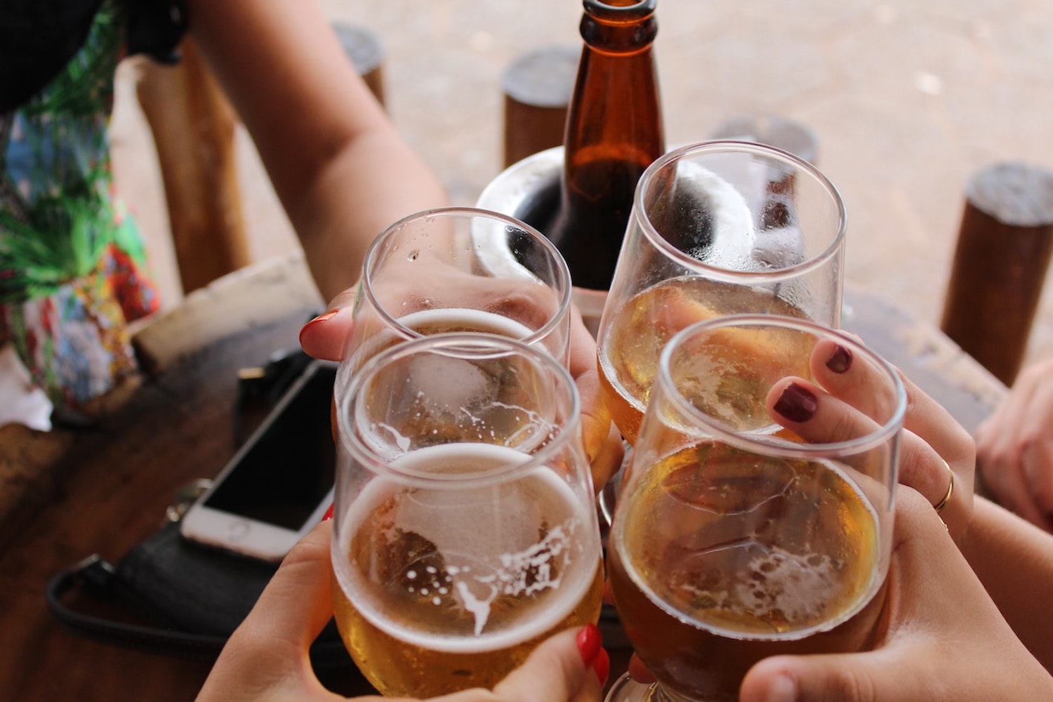 People toasting each other with beer