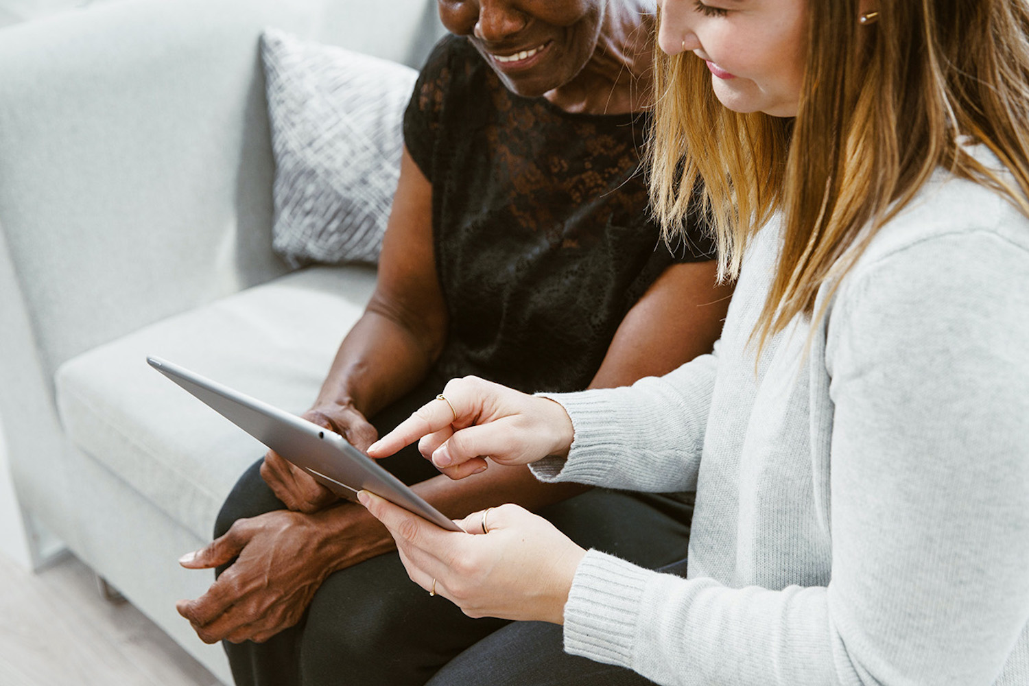 Two women looking at a tablet computer