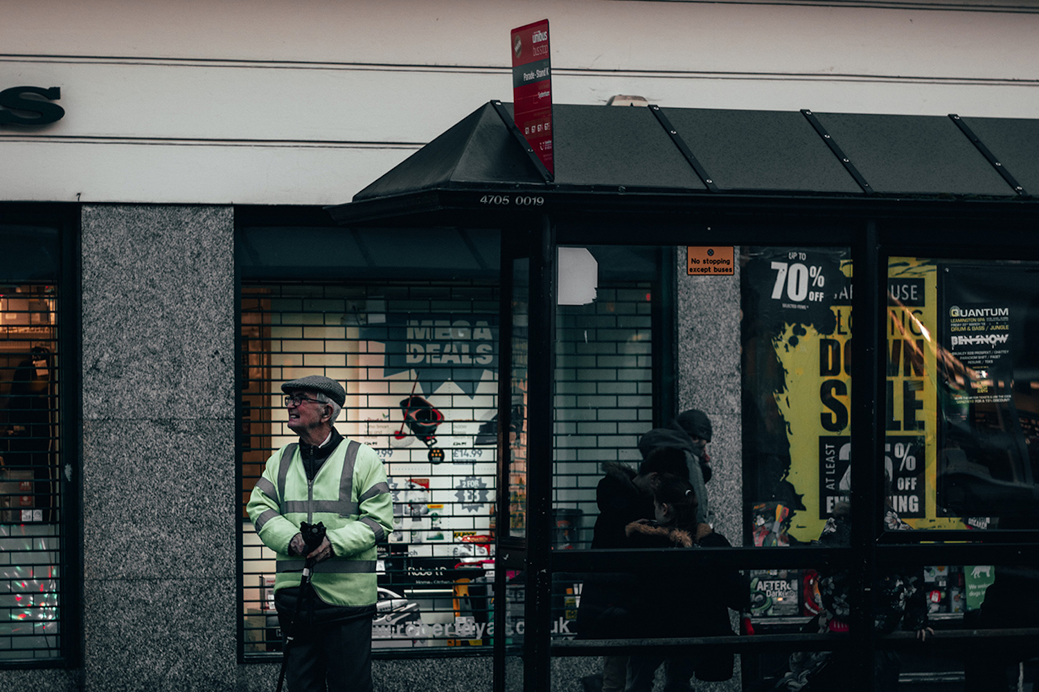 People waiting at a bus stop