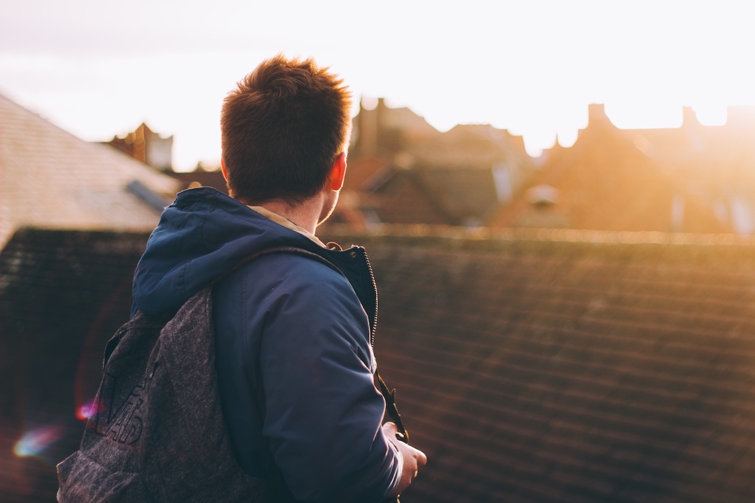 A man looking out on to a town