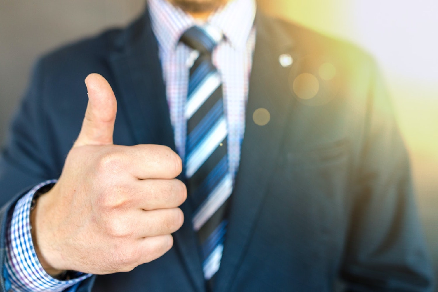 A man giving a thumbs up sign